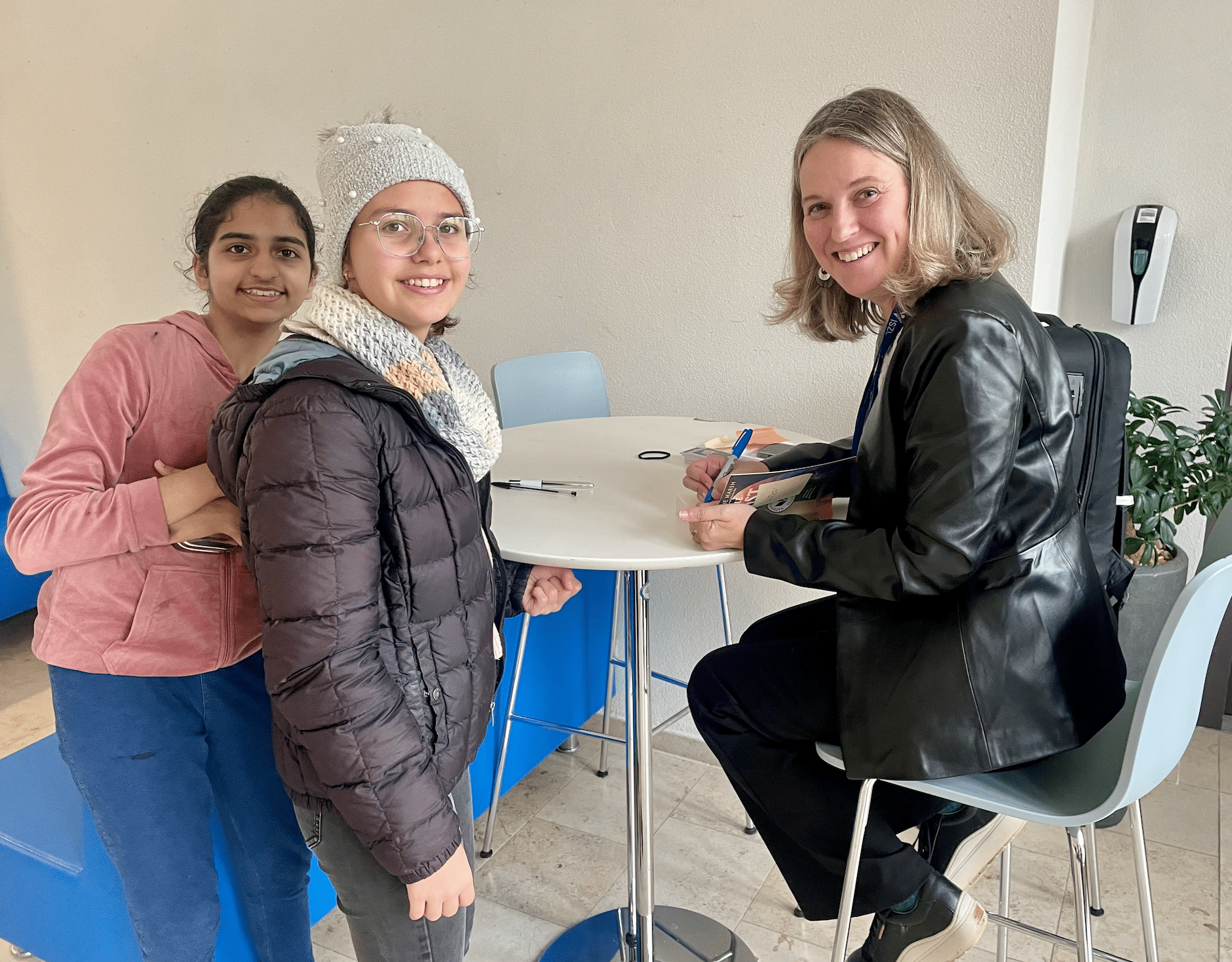 student book signing with author
